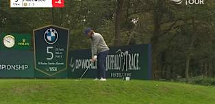 Tommy Fleetwood takes aim at the pin on the par-three fifth