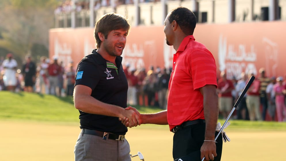 Robert Rock and Tiger Woods in Abu Dhabi