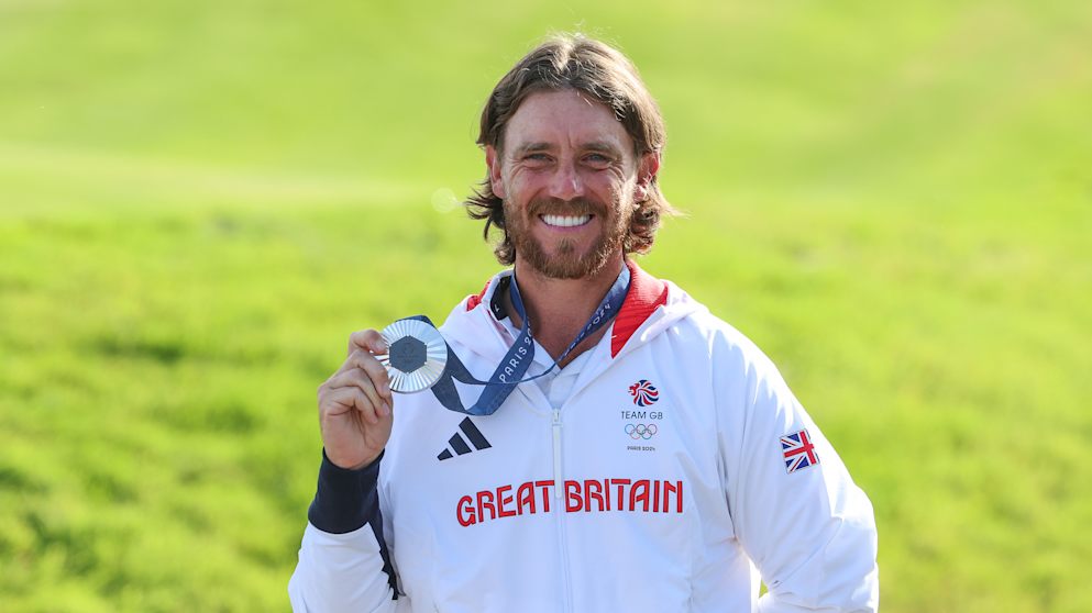 Tommy Fleetwood proudly displays his silver medal after adding to Team GB's medal count